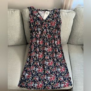 Very versatile, curve hugging mid length dress. Runs on the smaller side.